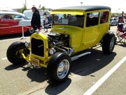 A yellow car parked in a parking lot

Description automatically generated with medium confidence