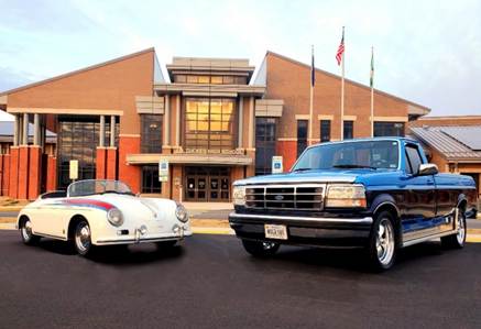 A car and a truck parked in front of a building

Description automatically generated with medium confidence